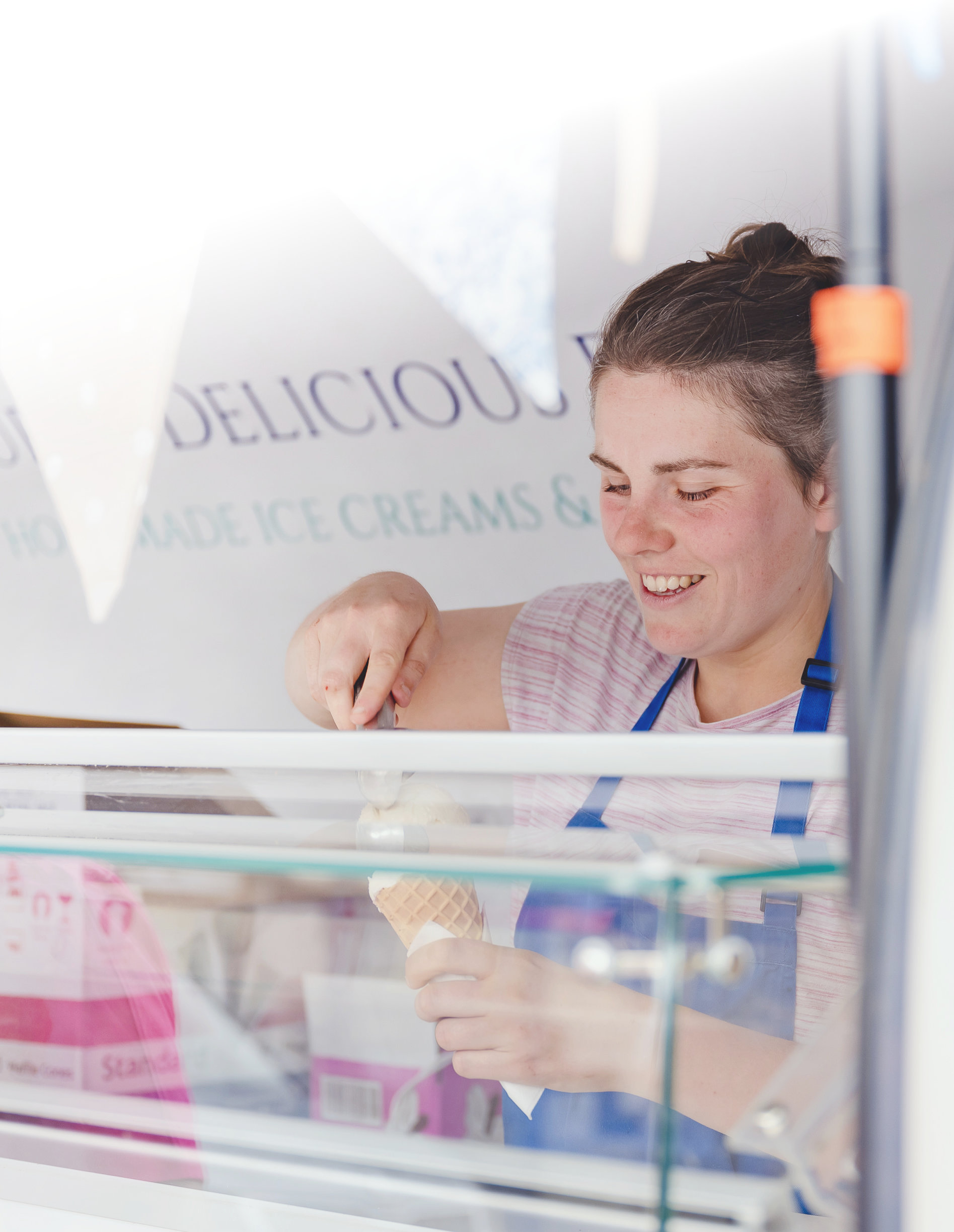 A woman scooping ice cream