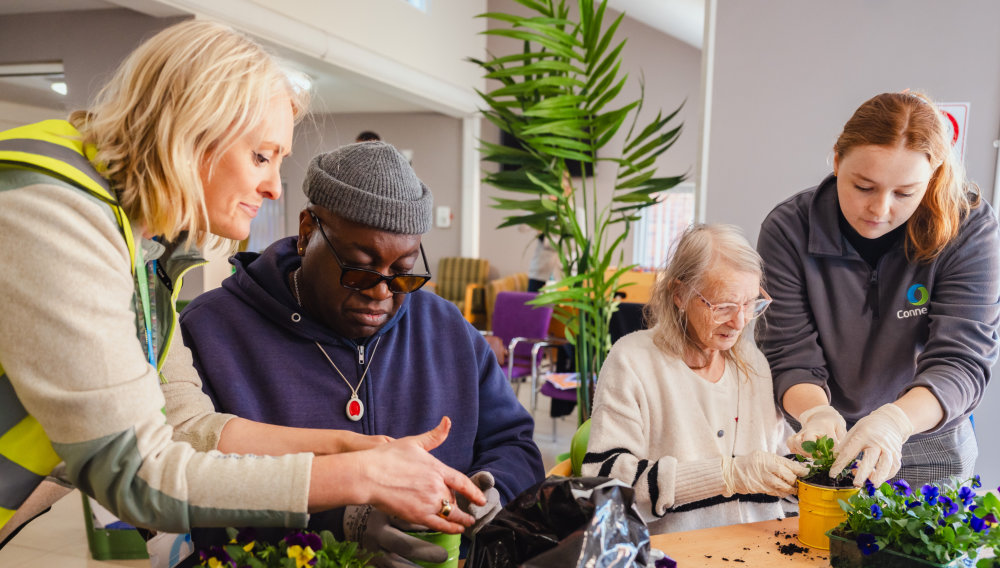 Connexus colleagues supporting residents at a recent communal garden makeover