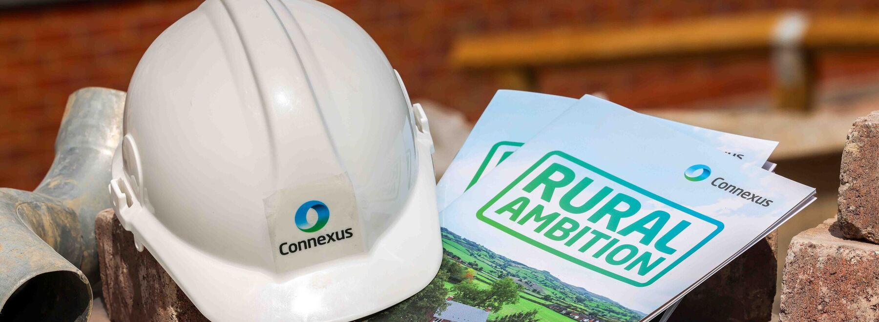 A Connexus hard hat and copies of Rural Ambition 