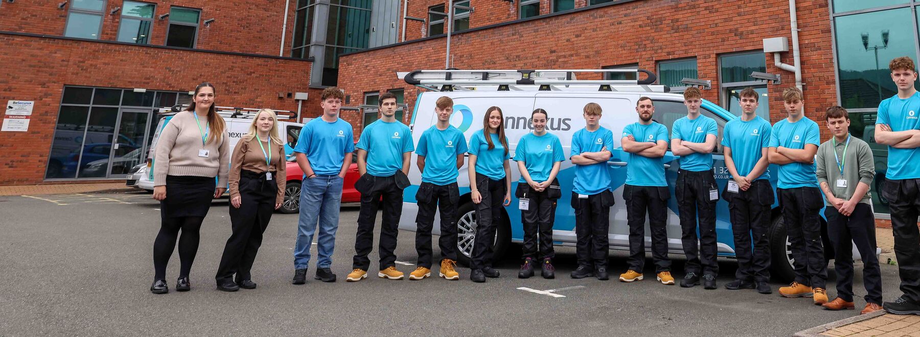 The apprentices standing outside the Connexus head office