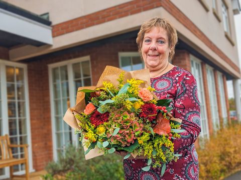 Margaret holding flowers