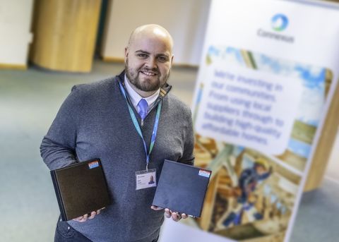 Connexus colleague with desktop computers for local schools