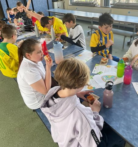Children enjoy a snack at the Holiday Activites and Food Programme, ran by The New Saints FC and supported by Shropshire Council and Connexus