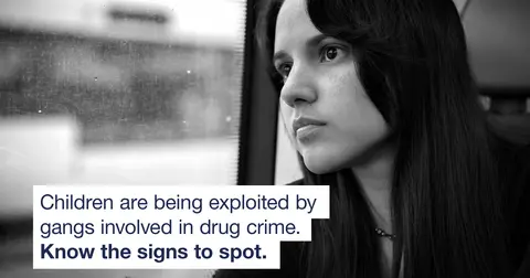 Black and white photo of a teenage girl on public transport