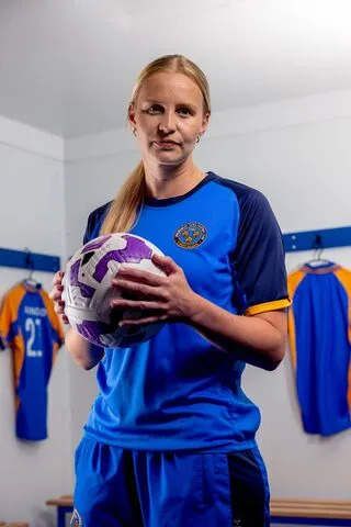 Vikki holding a ball