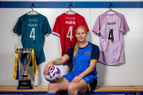 Vikki sits in the dressing room, next to the cup