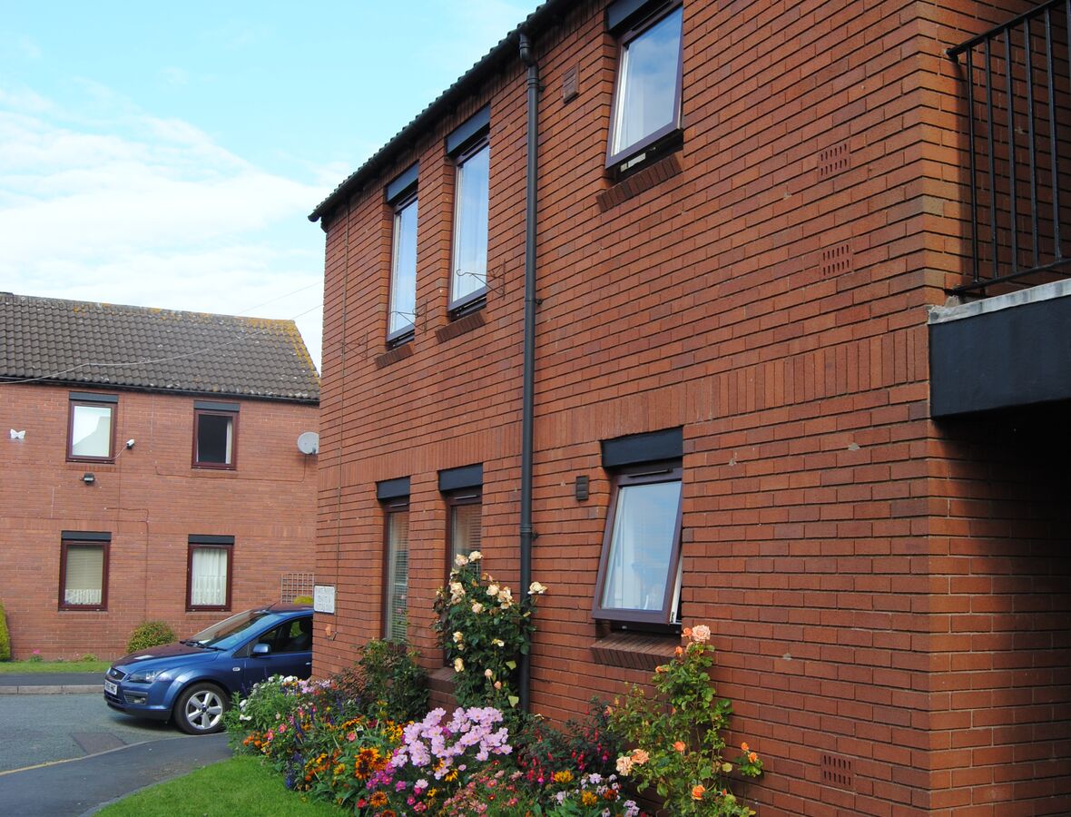 The side of a brick block at Normanbrook Court