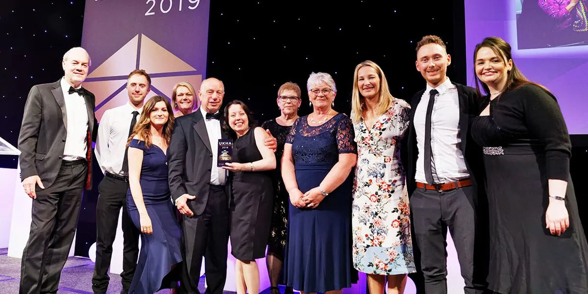 staff collecting award