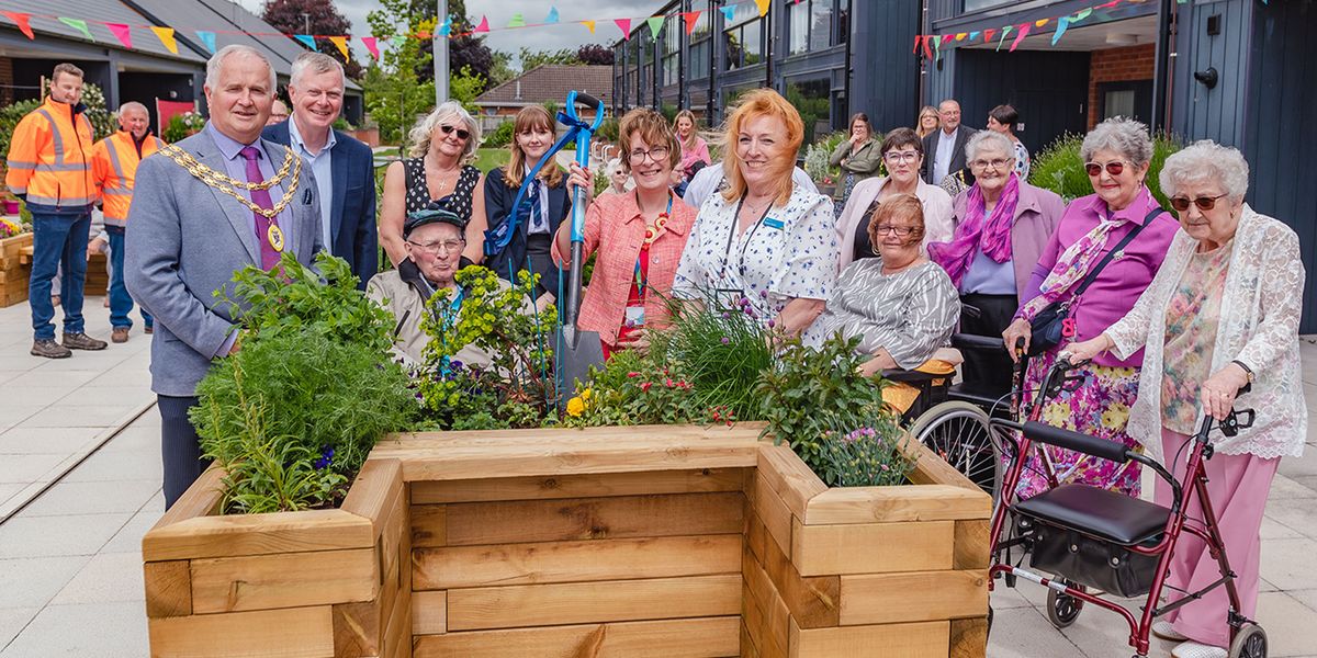 The Mayor of Wem, Councillor Peter Broomhall, officially opens the revamped community garden at our Westlands Independent Living Centre.