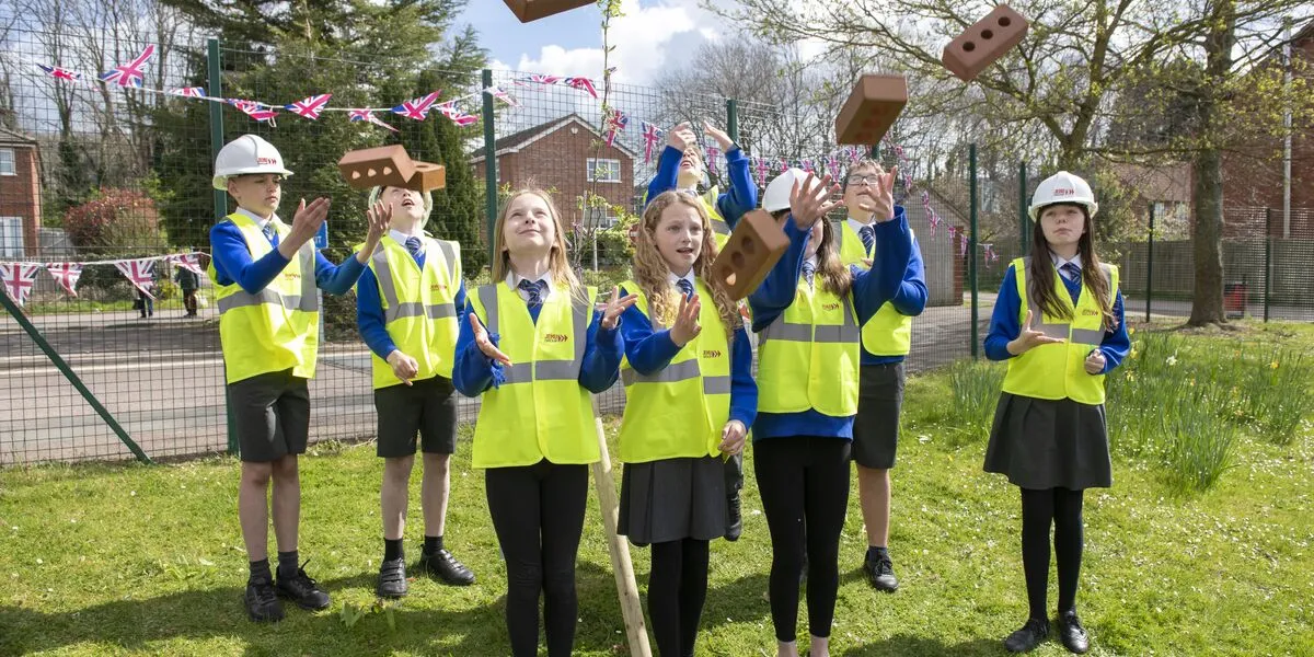 Children at Ledbury School celebrate naming roads on a local Connexus housing scheme 