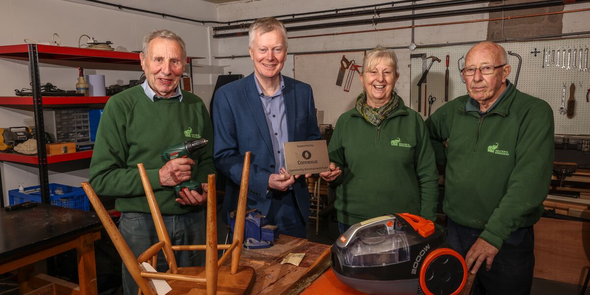 CEO Richard Woolley with volunteers from the workshop