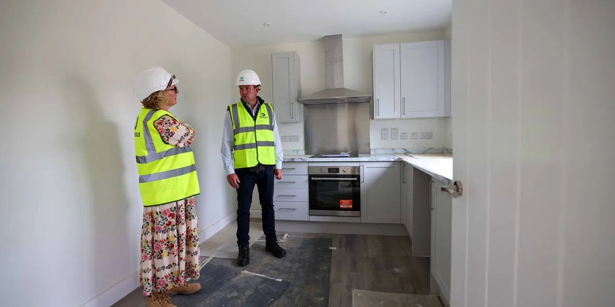 Kate and Stuart inspect a kitchen