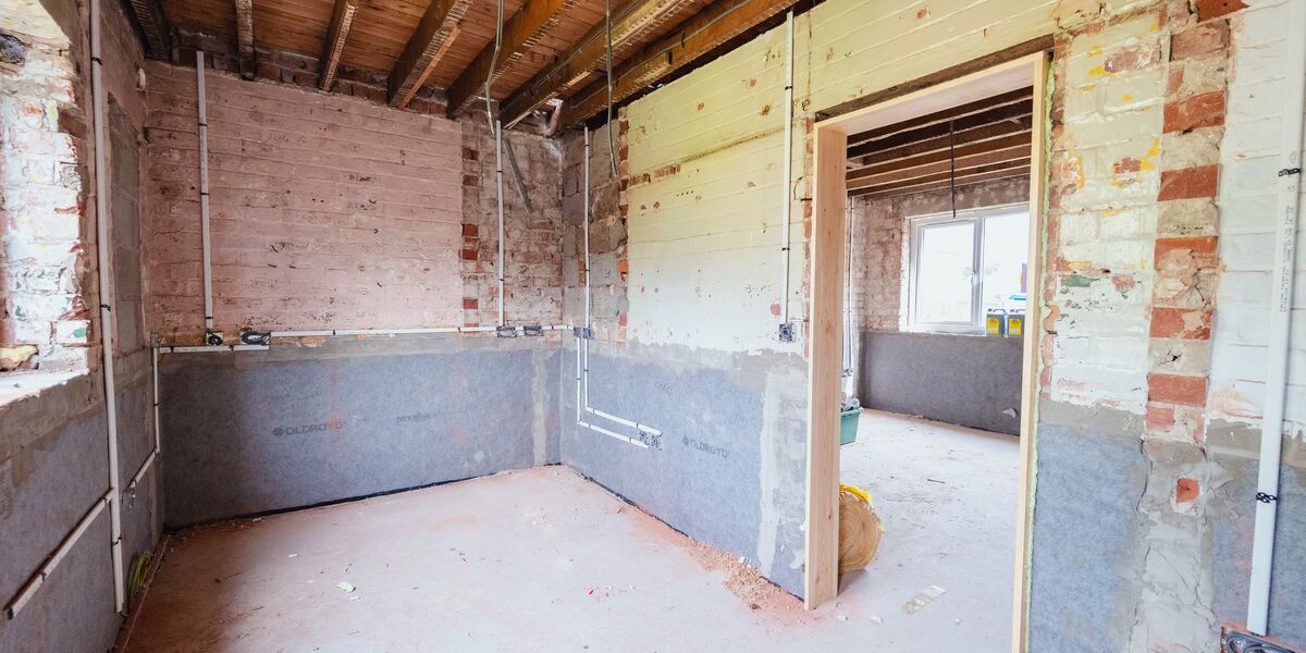 A kitchen stripped down to bare walls