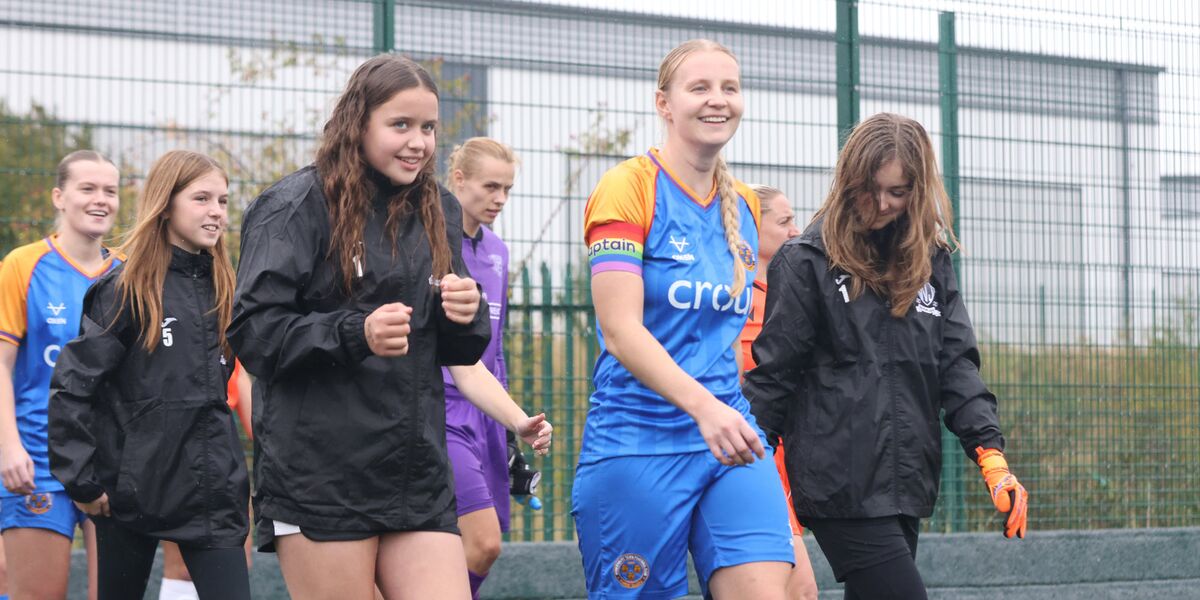 Vikki leads the team out