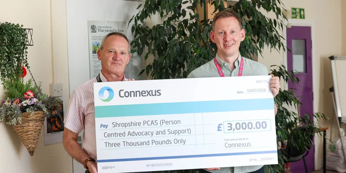 Simon and Nick with giant cheque