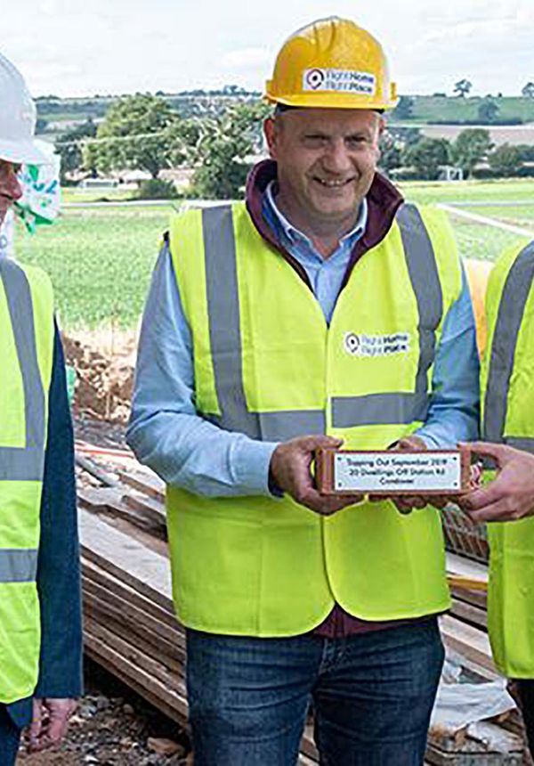 Three men in high vis & hardhats