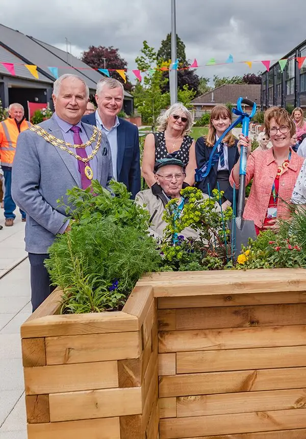 The Mayor of Wem, Councillor Peter Broomhall, officially opens the revamped community garden at our Westlands Independent Living Centre. 