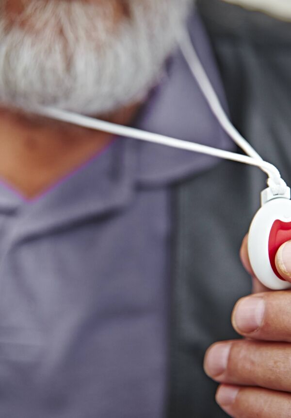 man with alarm pendant