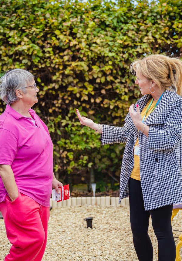 Sian talking to a female Connexus customer in her garden.