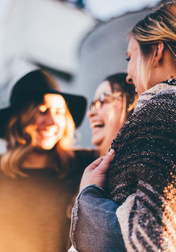 3 women laughing and chatting