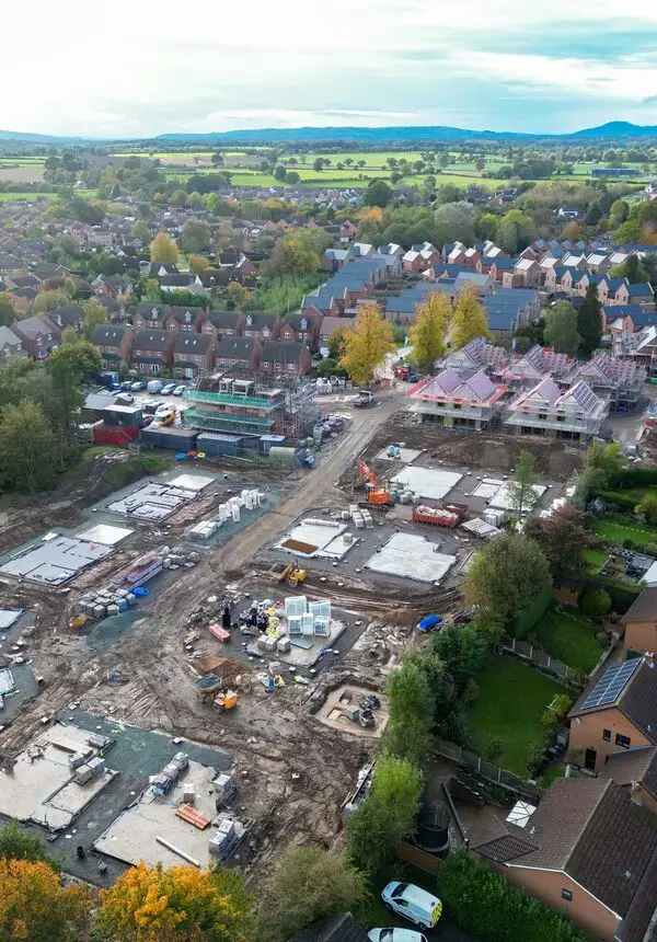 Drone photo of building site with some completed homes and some homes under construction 