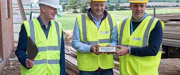 Three men in high vis & hardhats