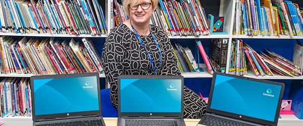Alison Benge (Head of School, Mount Pleasant Primary) with computers donated by Connexus