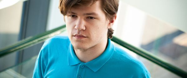 Young male standing in a stairwell