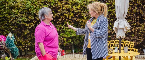 Sian talking to a female Connexus customer in her garden.