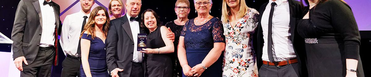 staff collecting award