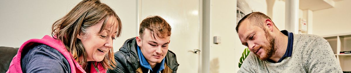 Support worker with residents at the Ludlow Foyer and Grain Loft supported accomodation