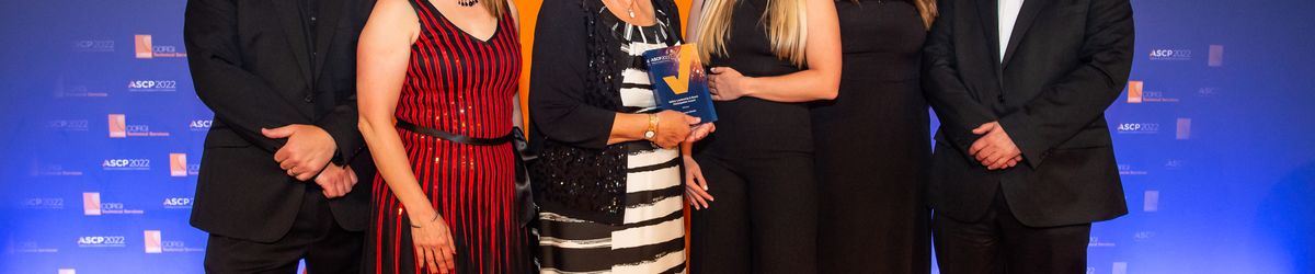 The team from Connexus receiving the award on stage at ASCP Awards.