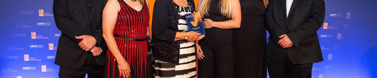 The team from Connexus receiving the award on stage at ASCP Awards. 