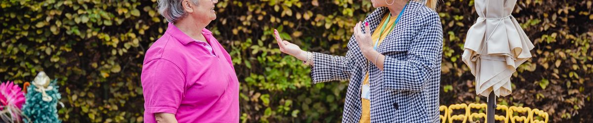 Sian talking to a female Connexus customer in her garden.
