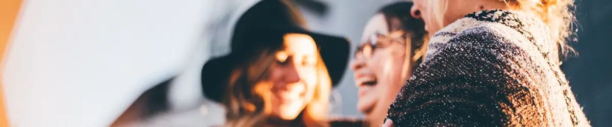 3 women laughing and chatting