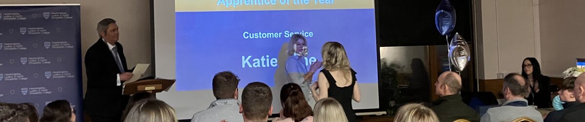 Katie accepting award