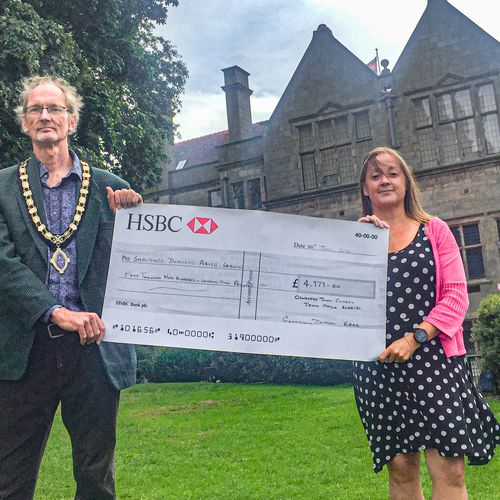 Oswestry Mayor Cllr Duncan Kerr present a cheque to Wendy Bulman, Domestic Abuse Support Service Manager