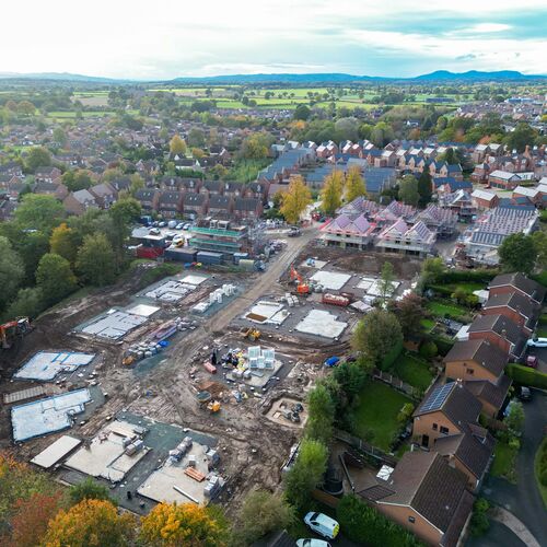 Drone photo of building site with some completed homes and some homes under construction